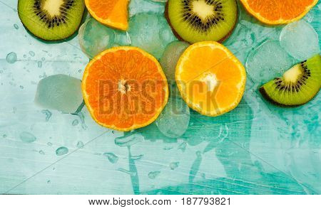 Fresh orange macro in ice cubes background.