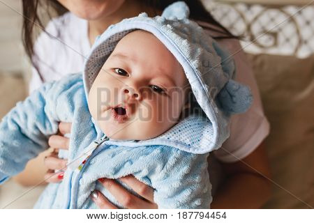 Portrait of a little adorable newborn infant asian baby.