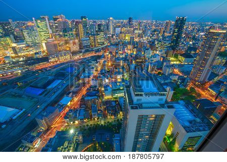Aerial view of Osaka City Central Business downtown at twilight. Osaka Skyline from Floating Garden Observatory Umeda Sky Building in Kita Ward, Japan.