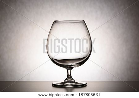 Single Empty Brandy Glass. The Concept Of Emptiness, Of Purity, Thoughtlessness, A Crisis Of Ideas