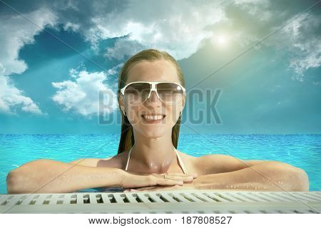 Beautiful happiness girl in white bikini stay in the waterpool