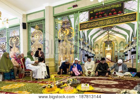 Photo of Masjid Sultan at Muscat Street in Kampong Glam district of Rochor Planning Area in Singapore. Muslim prayers inside the mosque. MARCH 2017