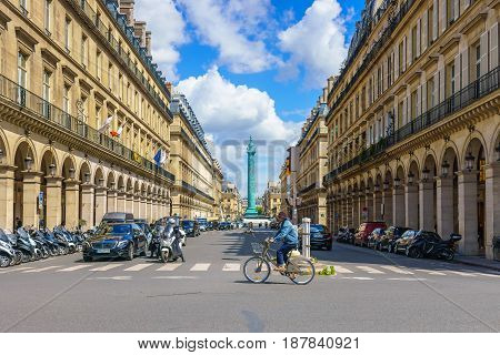 Paris France - May 2 2017: Traffic conditions on Castiglione Street and the beautiful old architecture along the way with Place Vendome Square in a background on May 2 2017 in Paris France.