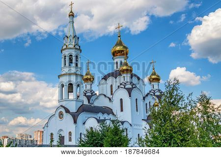 Russian Orthodox church with golden domes on sunny day