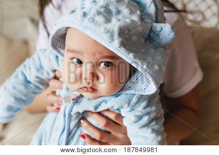 Portrait of a little adorable newborn infant asian baby.