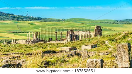 VOLUBILIS ,MOROCCO - APRIL 7,2017 - View at the ruins of Volubulis in Morocco. Volubilis is a partly excavated Berber and Roman city in Morocco situated near the city of Meknes.