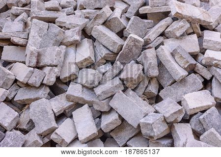 The disassembled stone pavement is a pile on the road.
