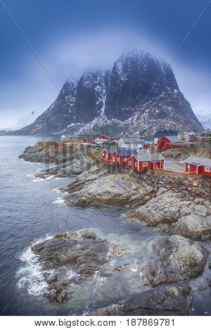 Travel Concepts and Ideas. Traditional Fishing Hut Village in Hamnoy During Early Spring Time in Lofoten Islands Norway. Vertical Image Composition