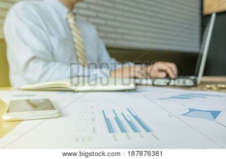 business man working document and laptop in office morning light. business concept.