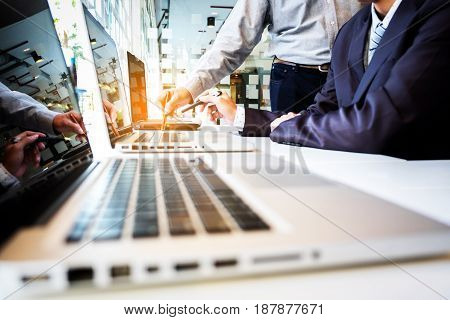 Two businessmen looking at report and having a discussion in office. business concept.
