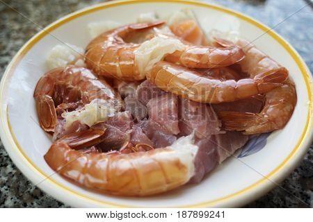 shrimps mixed with variety of cubes of fillet fishes to prepare the Italian pasta al misto mare