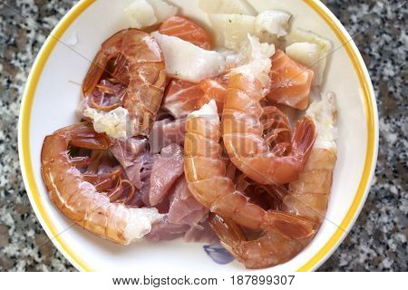 shrimps mixed with variety of cubes of fillet fishes to prepare the Italian pasta al misto mare