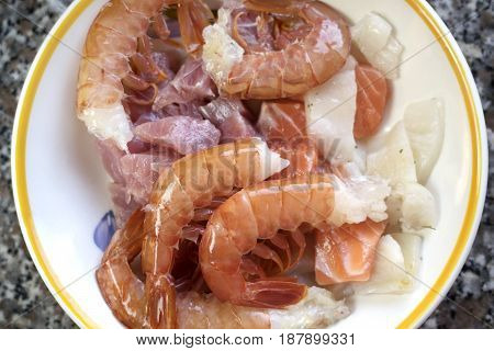 shrimps mixed with variety of cubes of fillet fishes to prepare the Italian pasta al misto mare