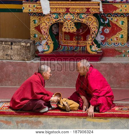 LAMAYURU INDIA - JUNE 13 2015: Unidentified two buddhist monk during mystical mask dancing Tsam mystery dance in time of Yuru Kabgyat Buddhist festival at Lamayuru Gompa Ladakh North India