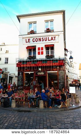 PARIS , France- May 21, 2017: View of typical paris cafe in Paris. Montmartre area is among most popular destinations in Paris, Le Consulat is a typical cafe.
