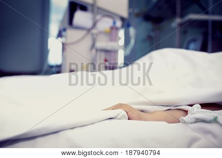 Patient confined to bed in hospital room.