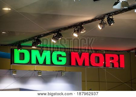 Moscow, Russia - May, 2017: DMG Mori company logo on the wall. DMG Mori Seiki Co is a Japanese company engaged primarily in the manufacture and sale of machine tools.