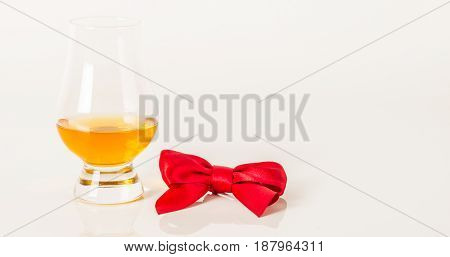 Single Malt Tasting Glass, Single Malt Whisky In A Glass, White Background, Red Bow