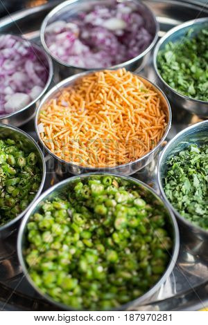 A Close Up Of Small Dishes Of Mixed Punjabi Food