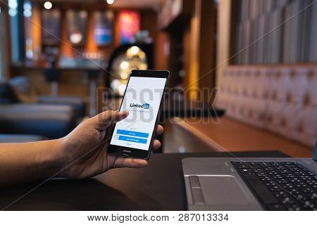 Chiang Mai, Thailand - May 05,2018: Man Holding Huawei Mobile Phone With Linkedin Application On The