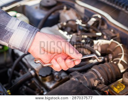 Hand Of Auto Mechanic Man With A Wrench. Car Repair Concept, Husky Metric Drive Ratcheting