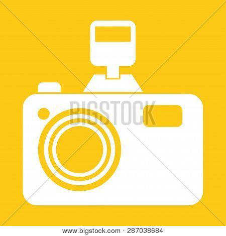 Camera With Flash On A Yellow Background