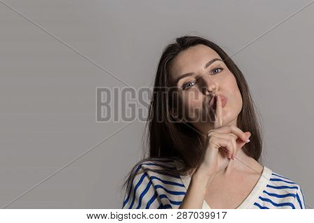 A Pretty Woman With Fluffy Hair, Dressed Casually. Studio Shot Of A Lovely Beautiful Woman Isolated 