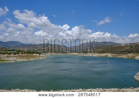 Scenic Landscape Shot Of Germasogeia Dam In Cyprus On A Beautiful Blue Sky Day.  Wind Patterns On Th
