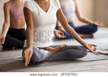 Yogi Black Woman Practicing Yoga Lesson, Ardha Padmasana Pose