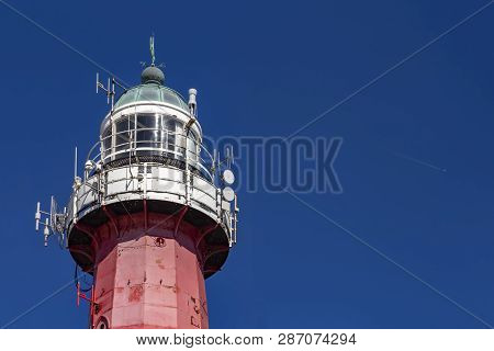 Lighthouse In Schevenigen, The Hague Beatch Against A Pur And Blue Sky At Summer Time