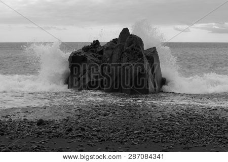 Waves Breaking At The Rock On Stone Coastline. Praia Formosa Beach In Funchal, Portugal