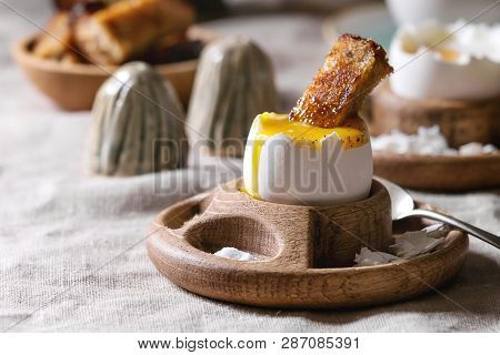 Breakfast With Cup Of Coffee And Soft Boiled Egg, Served In Wooden Egg Cup With Salt, Pepper And Toa