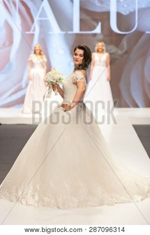 ZAGREB, CROATIA - FEBRUARY 02, 2019: Croatian singer Romana Pavlisa in a wedding dress walking down the runway at the Wedding fair