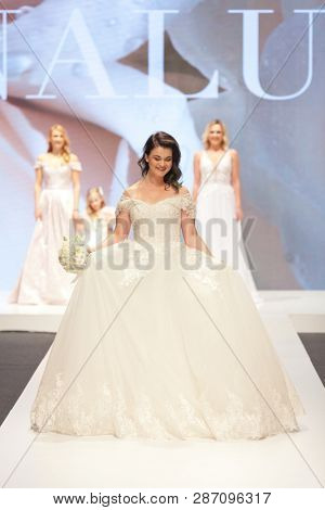 ZAGREB, CROATIA - FEBRUARY 02, 2019: Croatian singer Romana Pavlisa in a wedding dress walking down the runway at the Wedding fair