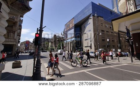 Bucharest, Romania - May 17, 2018: The Pedestrians Cross Calea Victoriei Street In Downtown Buchares