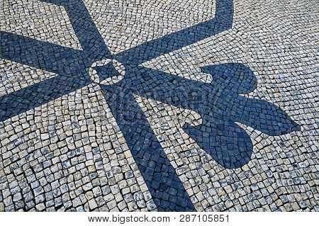 Traditional Portuguese Stone Mosaic Calcade With Basalt And Limestone On Lisbon, Portugal