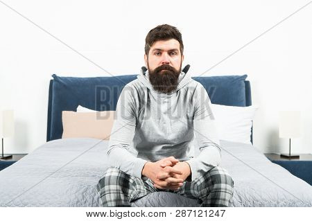 Tips For Waking Up Early. Man Bearded Hipster Sleepy Face Pajamas Waking Up Bedroom Interior. Daily 