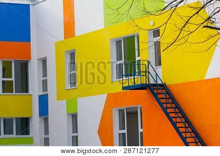 Multi-colored Windows Of The School In A Contemporary Style. Architecture