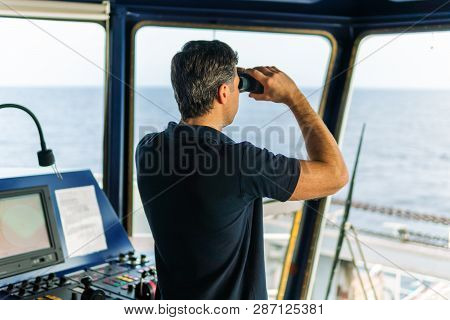 Officer During Navigational Watch Looking Through Binoculars