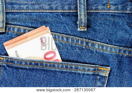 Several Bills Of Ten Euros In The Back Pocket Of Jeans. Concept Of Absentminded Person, Potential Vi