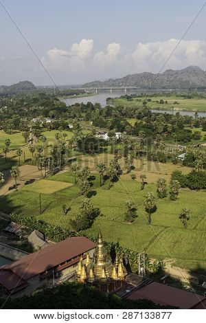 Vertical Picture Of Golden Pagoda, Local Vegetation And Thanlwin Bridge In Hpa-an, Myanmar