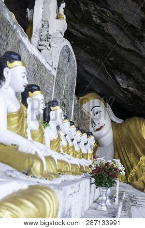Hpa-an, Myanmar - 19 November, 2018: Vertical Picture Of Many Buddha Statues Inside Yathaypyan Cave,