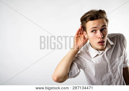 Curious Young Man In White Is Eager To Know All The Gossip.