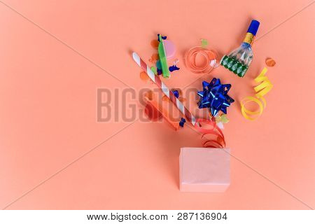 Red Gift Box With Streamers And Noisemakers