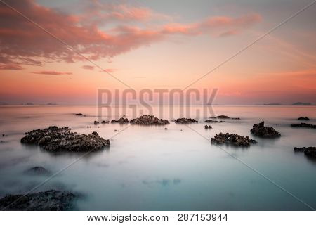 Softness Of The Waves And The Long Exposures Of Waves Like Coral Rocks That Emerge From The Fog And 