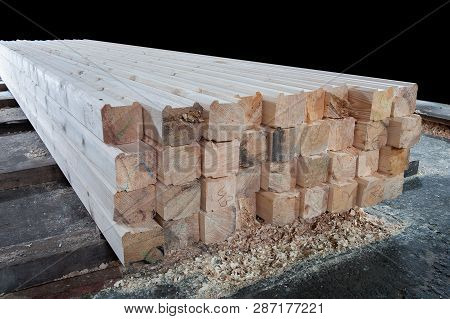 Wood At The Sawmill. Lumber Is Stored In The Warehouse.