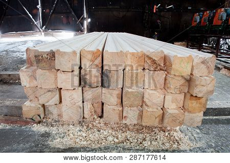 Wood At The Sawmill. Lumber Is Stored In The Warehouse.