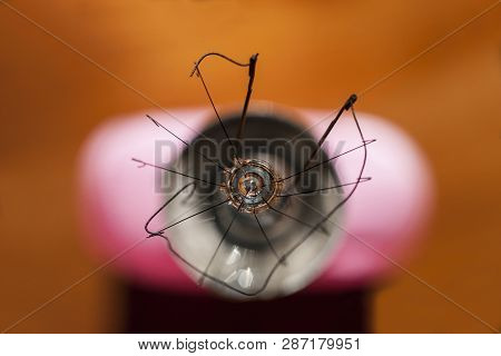 Abstract Picture Of Filament In Broken Light Bulb Seen From Top