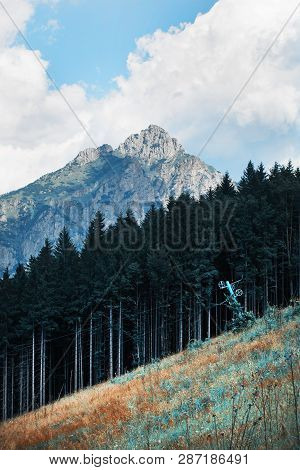 Old Ski Lift And Forest In The Foreground. Big Rozsutec (velky Rozsutec), Mala Fatra Mountain, Slova