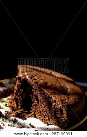 Piece Of Homemede Chocolate Sponge Cake On Black Background